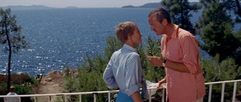 Movie still from “Bonjour Tristesse” (1958), directed by Otto Preminger – A man and a boy standing next to each other near the ocean; Medium shot, Low angle