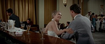 Movie still from “Bonjour Tristesse” (1958), directed by Otto Preminger – A man and a woman sitting at a bar; Medium shot, Over the shoulder angle