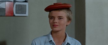 Movie still from “Bonjour Tristesse” (1958), directed by Otto Preminger – A woman with a hat on top of her head; Close Up shot, Low angle