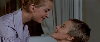 Movie still from “Bonjour Tristesse” (1958), directed by Otto Preminger – A woman and a boy looking at one another; Close Up shot, Over the shoulder angle