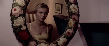 Movie still from “Bonjour Tristesse” (1958), directed by Otto Preminger – A woman looking at herself in a mirror; Close Up shot, Over the shoulder angle