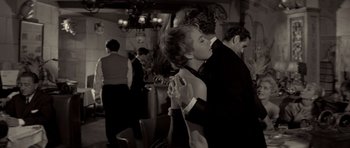 Movie still from “Bonjour Tristesse” (1958), directed by Otto Preminger – A man and a woman are dancing in a restaurant; Medium shot, Low angle