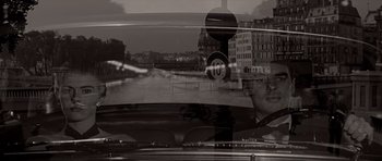 Movie still from “Bonjour Tristesse” (1958), directed by Otto Preminger – A black and white photo of a car windshield; Medium shot, Over the shoulder angle