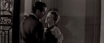 Movie still from “Bonjour Tristesse” (1958), directed by Otto Preminger – A man and a woman are dancing together; Medium shot, Over the shoulder angle