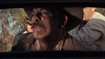 Movie still from “Bonnie and Clyde” (1967), directed by Arthur Penn – A person wearing a hat; Close Up shot, Over the shoulder angle