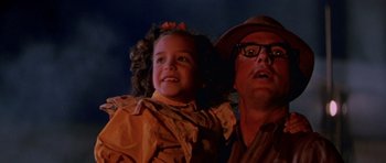Movie still from “Born on the Fourth of July” (1989), directed by Oliver Stone – A man and a little girl standing next to each other; Close Up shot, Low angle