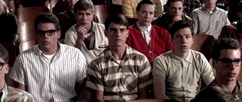 Movie still from “Born on the Fourth of July” (1989), directed by Oliver Stone – A group of young men sitting in front of each other; Medium shot, High angle