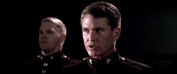 Movie still from “Born on the Fourth of July” (1989), directed by Oliver Stone – A man in a military uniform looking at the camera; Close Up shot, Low angle