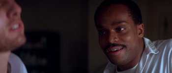 Movie still from “Born on the Fourth of July” (1989), directed by Oliver Stone – A person smiling for the camera; Close Up shot, Low angle