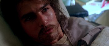Movie still from “Born on the Fourth of July” (1989), directed by Oliver Stone – A person with a beard; Close Up shot, High angle