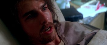 Movie still from “Born on the Fourth of July” (1989), directed by Oliver Stone – A person with long hair; Close Up shot, High angle