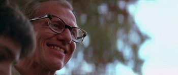 Movie still from “Born on the Fourth of July” (1989), directed by Oliver Stone – A person wearing glasses; Close Up shot, Low angle