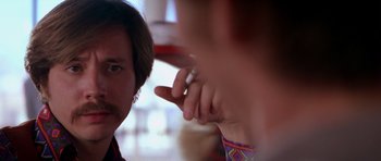 Movie still from “Born on the Fourth of July” (1989), directed by Oliver Stone – A man with a beard and mustache pointing at a woman's face; Close Up shot, Over the shoulder angle