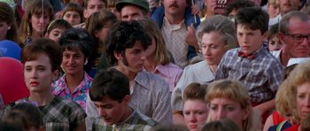Movie still from “Born on the Fourth of July” (1989), directed by Oliver Stone – A group of people sitting in a room; Medium shot, High angle