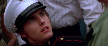 Movie still from “Born on the Fourth of July” (1989), directed by Oliver Stone – A person wearing a uniform; Close Up shot, Low angle
