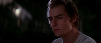 Movie still from “Born on the Fourth of July” (1989), directed by Oliver Stone – A young man is looking into the distance; Close Up shot, Over the shoulder angle