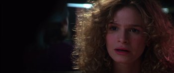 Movie still from “Born on the Fourth of July” (1989), directed by Oliver Stone – A person with curly brown hair; Close Up shot, Low angle