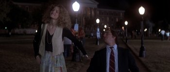 Movie still from “Born on the Fourth of July” (1989), directed by Oliver Stone – A man and a woman are dancing in the dark; Medium shot, Low angle