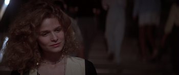 Movie still from “Born on the Fourth of July” (1989), directed by Oliver Stone – A person wearing a necklace; Close Up shot, Over the shoulder angle