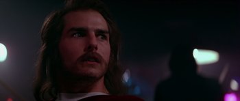 Movie still from “Born on the Fourth of July” (1989), directed by Oliver Stone – A person with long hair; Close Up shot, Over the shoulder angle