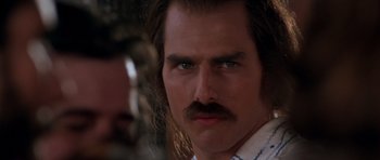 Movie still from “Born on the Fourth of July” (1989), directed by Oliver Stone – A person with a mustache; Close Up shot, Over the shoulder angle