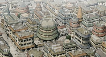 An aerial view of a city with many buildings