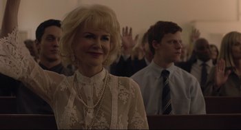 Movie still from “Boy Erased” (2018), directed by Joel Edgerton – A group of people sitting in front of each other in a room; Close Up shot, Low angle