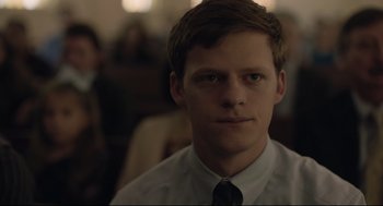 Movie still from “Boy Erased” (2018), directed by Joel Edgerton – A man in a white dress shirt and tie; Close Up shot, Over the shoulder angle