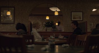 Movie still from “Boy Erased” (2018), directed by Joel Edgerton – Two people are sitting at a table in a restaurant; Medium shot, Over the shoulder angle
