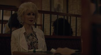 Movie still from “Boy Erased” (2018), directed by Joel Edgerton – A woman sitting at a table in front of a person; Medium shot, Over the shoulder angle