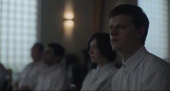 Movie still from “Boy Erased” (2018), directed by Joel Edgerton – A group of people standing next to each other in a room; Close Up shot, Over the shoulder angle