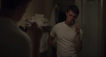 Movie still from “Boy Erased” (2018), directed by Joel Edgerton – A man brushing his teeth in a bathroom; Medium shot, Over the shoulder angle