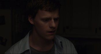 Movie still from “Boy Erased” (2018), directed by Joel Edgerton – A young man in a dark room looking down at the ceiling; Close Up shot, Over the shoulder angle