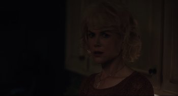 Movie still from “Boy Erased” (2018), directed by Joel Edgerton – A woman with blonde curly hair wearing a red dress; Close Up shot, Over the shoulder angle