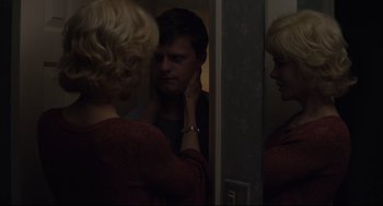 Movie still from “Boy Erased” (2018), directed by Joel Edgerton – A woman standing in front of a mirror looking at a man; Close Up shot, Over the shoulder angle