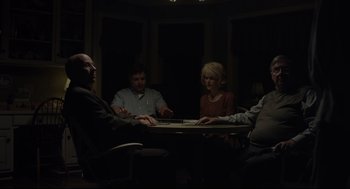 Movie still from “Boy Erased” (2018), directed by Joel Edgerton – A group of people sitting around a table; Medium shot, High angle