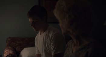 Movie still from “Boy Erased” (2018), directed by Joel Edgerton – A man and a woman sitting on a bed; Medium shot, Over the shoulder angle