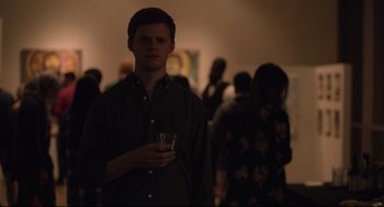 Movie still from “Boy Erased” (2018), directed by Joel Edgerton – A man holding a glass of wine in his hand; Medium shot, Over the shoulder angle