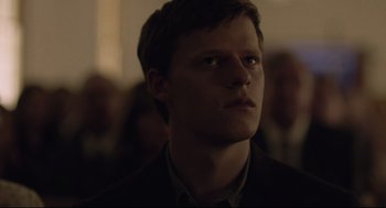 Movie still from “Boy Erased” (2018), directed by Joel Edgerton – A man in a suit looking to his left; Close Up shot, Low angle