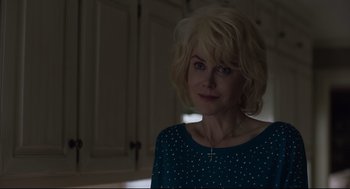 Movie still from “Boy Erased” (2018), directed by Joel Edgerton – A woman with blonde hair wearing a blue shirt; Close Up shot, Over the shoulder angle