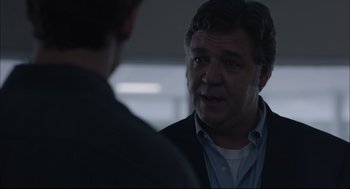 Movie still from “Boy Erased” (2018), directed by Joel Edgerton – A man talking to another man in front of a building; Close Up shot, Over the shoulder angle