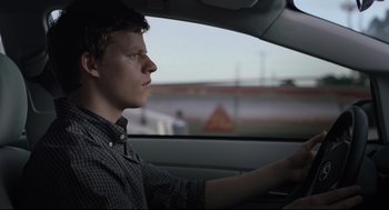 Movie still from “Boy Erased” (2018), directed by Joel Edgerton – A young man driving a car in the daytime; Close Up shot, Over the shoulder angle