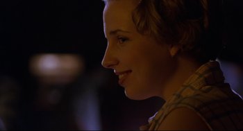 Movie still from “Boys Don't Cry” (1999), directed by Kimberly Peirce – A woman's face in the dark; Close Up shot, Over the shoulder angle
