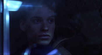 Movie still from “Boys Don't Cry” (1999), directed by Kimberly Peirce – A young man is looking into the camera; Close Up shot, Low angle