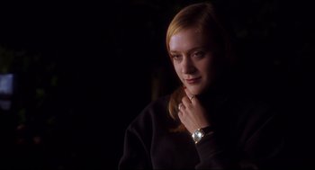 Movie still from “Boys Don't Cry” (1999), directed by Kimberly Peirce – A young woman is posing for a picture; Close Up shot, Low angle