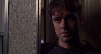 Movie still from “Boys Don't Cry” (1999), directed by Kimberly Peirce – A person looking at the camera; Close Up shot, Over the shoulder angle