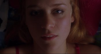 Movie still from “Boys Don't Cry” (1999), directed by Kimberly Peirce – A young woman's face; Close Up shot, Overhead angle