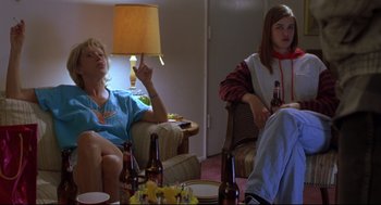 Movie still from “Boys Don't Cry” (1999), directed by Kimberly Peirce – Two women sitting in a living room drinking beer; Medium shot, Low angle