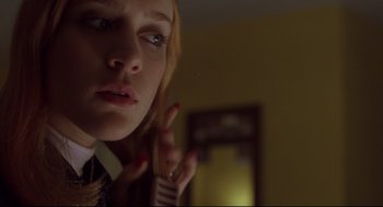 Movie still from “Boys Don't Cry” (1999), directed by Kimberly Peirce – A woman with her fingers in her mouth; Close Up shot, Low angle