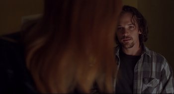 Movie still from “Boys Don't Cry” (1999), directed by Kimberly Peirce – A man looking at a woman in a mirror; Close Up shot, Over the shoulder angle
